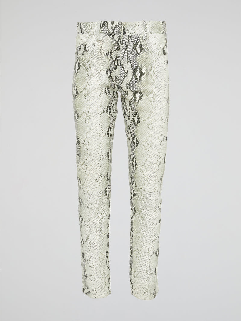 Infuse your wardrobe with a touch of wild sophistication with these snake print skinny trousers from Roberto Cavalli. Crafted from luxurious fabric, these statement pants will elevate any outfit from basic to bold in an instant. Step out in style and turn heads wherever you go with these modern, edgy trousers that exude confidence and glamour.