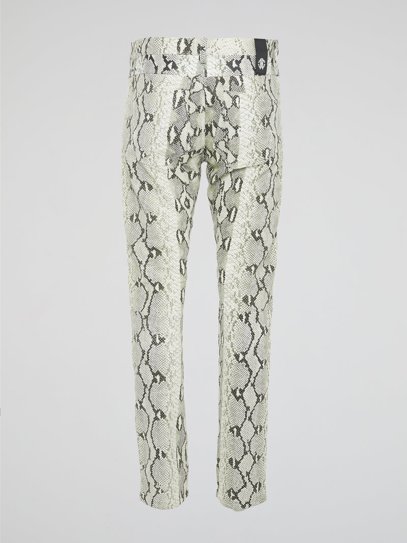 Infuse your wardrobe with a touch of wild sophistication with these snake print skinny trousers from Roberto Cavalli. Crafted from luxurious fabric, these statement pants will elevate any outfit from basic to bold in an instant. Step out in style and turn heads wherever you go with these modern, edgy trousers that exude confidence and glamour.