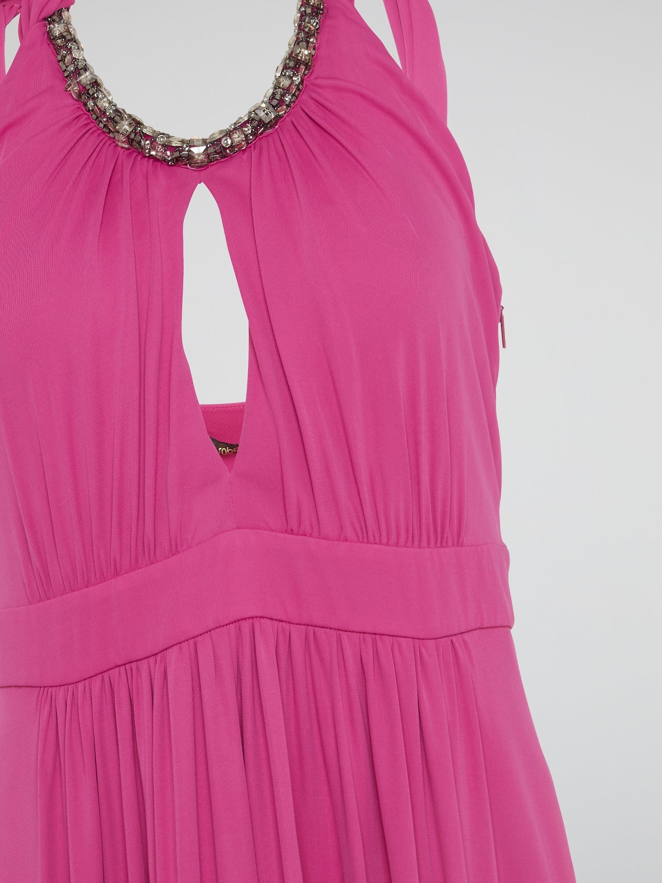 Channel your inner goddess in this stunning Pink Crystal Embellished Halter Neck Maxi Dress by Roberto Cavalli. The luxurious crystals add a touch of glamour to the flowy silhouette, making it perfect for any special occasion. Stand out from the crowd and turn heads wherever you go in this show-stopping piece.