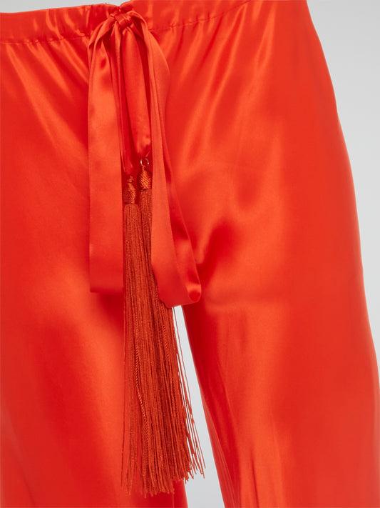Unleash your inner goddess with these stunning Red Silk Palazzo Pants by Roberto Cavalli. Walk confidently in the flowing silk fabric that drapes elegantly around your legs, exuding luxury and sophistication. Turn heads wherever you go with the bold red color that demands attention and leaves a lasting impression.