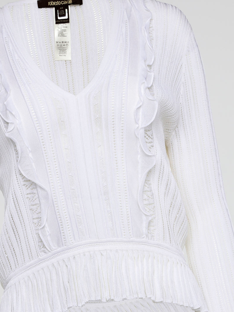 Elevate your wardrobe with the White Rib Knit Long Sleeve Top from Roberto Cavalli. Crafted with luxurious ribbed fabric, this top boasts a flattering silhouette and a timeless white hue perfect for any occasion. Embrace effortless elegance and make a statement with this must-have wardrobe staple.