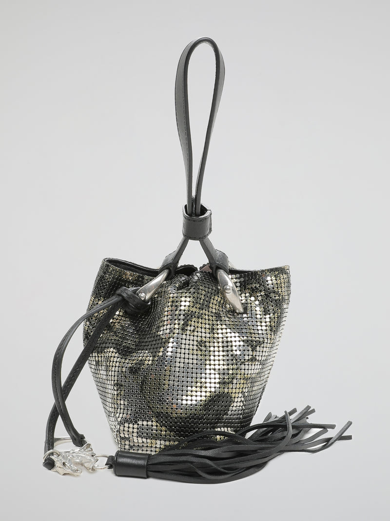 Our Roberto Cavalli Metallic Bucket Bag is the ultimate statement piece, perfect for the fashion-forward individual who loves to stand out from the crowd. Crafted with luxurious metallic leather and featuring the iconic Roberto Cavalli logo, this bag is both elegant and edgy, making it the perfect accessory for any outfit. Get ready to turn heads and elevate your style with this stunning bucket bag that exudes sophistication and glamour.