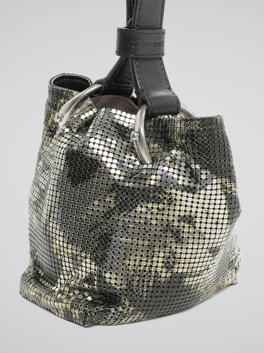 Our Roberto Cavalli Metallic Bucket Bag is the ultimate statement piece, perfect for the fashion-forward individual who loves to stand out from the crowd. Crafted with luxurious metallic leather and featuring the iconic Roberto Cavalli logo, this bag is both elegant and edgy, making it the perfect accessory for any outfit. Get ready to turn heads and elevate your style with this stunning bucket bag that exudes sophistication and glamour.