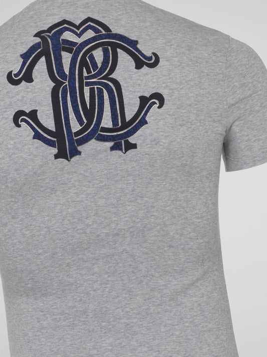 Elevate your everyday style with the effortlessly chic Grey Logo Print V-Neck T-Shirt from Roberto Cavalli Underwear. Crafted from soft, premium materials, this tee features a sleek logo print that adds a touch of luxury to your casual look. Perfect for layering or wearing on its own, this versatile piece will surely become a go-to in your wardrobe.