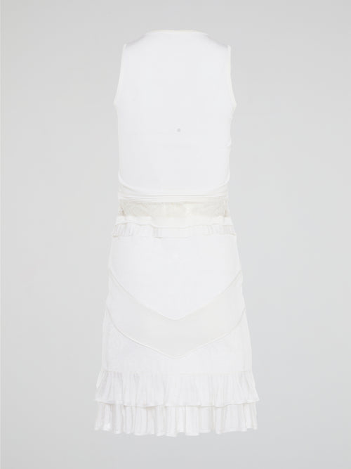 The White Ruffle Dress by Roberto Cavalli will transport you to dreamy summer nights with its ethereal charm. Crafted with intricate layers of delicate ruffles, this dress effortlessly merges elegance with playfulness. From a casual garden party to a glamorous evening soirée, this dress is guaranteed to turn heads and make you feel like a true goddess.