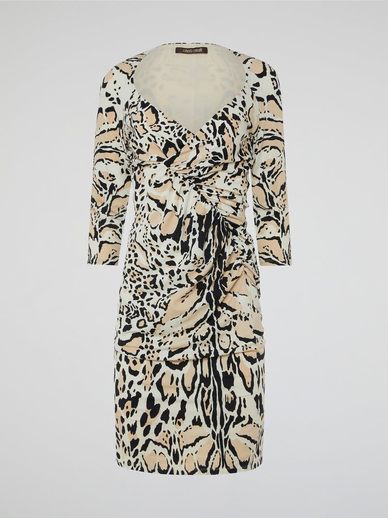 Step into the wild side of fashion with the Leopard Print Ruched Dress by Roberto Cavalli. This audaciously chic ensemble combines fierce leopard print with an artful ruched design, creating an irresistible allure. Whether it's a night on the town or an exclusive event, this dress is guaranteed to make a statement and unleash your inner untamed spirit.