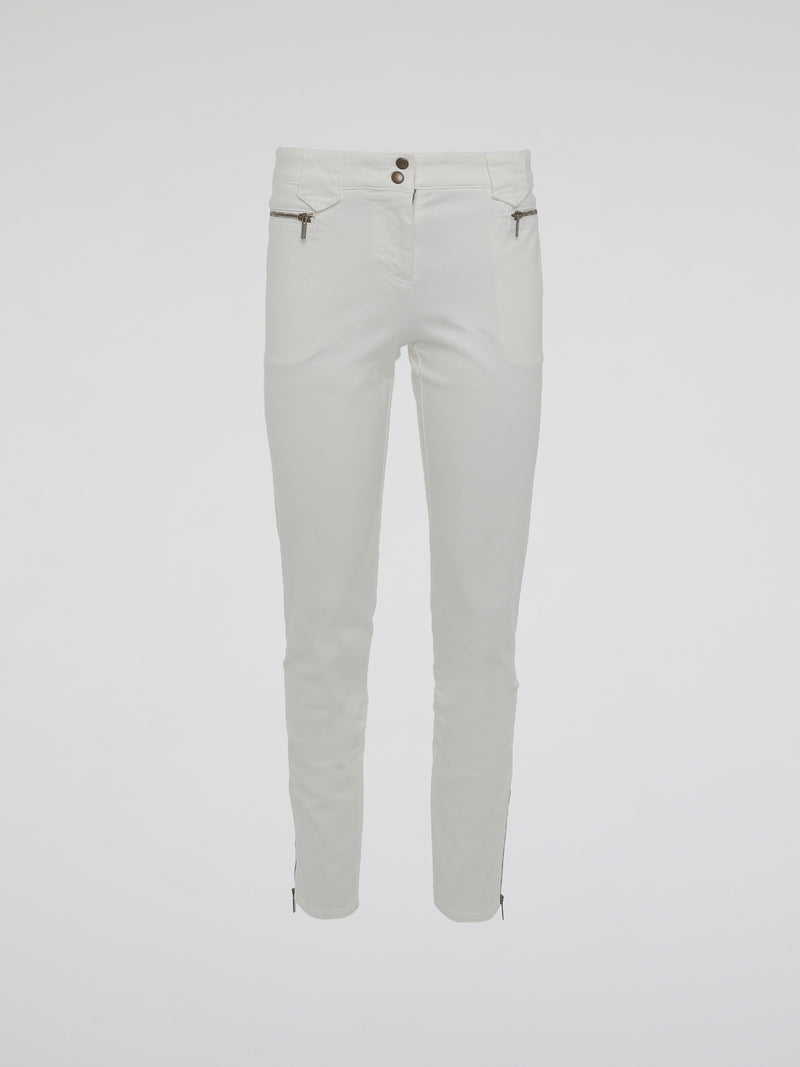 Introducing the epitome of style and sophistication - the White Zipper Detailed Trousers by Roberto Cavalli. These exquisite trousers blend modern minimalism with edgy details, boasting a sleek white hue that exudes elegance. The alluring zipper accents strategically placed throughout add a touch of rebellious charm, making these trousers a true fashion statement.