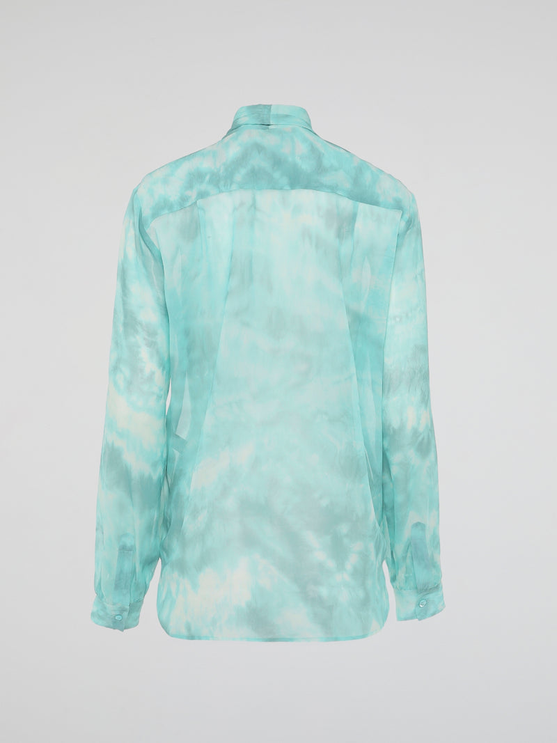 Embrace a vibrant and eco-friendly fashion statement with our Green Tie Dye Blouse by Roberto Cavalli. Crafted with exquisite attention to detail, this unique piece seamlessly combines the timeless elegance of a blouse with the bold and playful allure of tie-dye. Whether you're strolling through a music festival or elevating your everyday style, this blouse promises to make a head-turning statement, while embracing sustainable fashion.