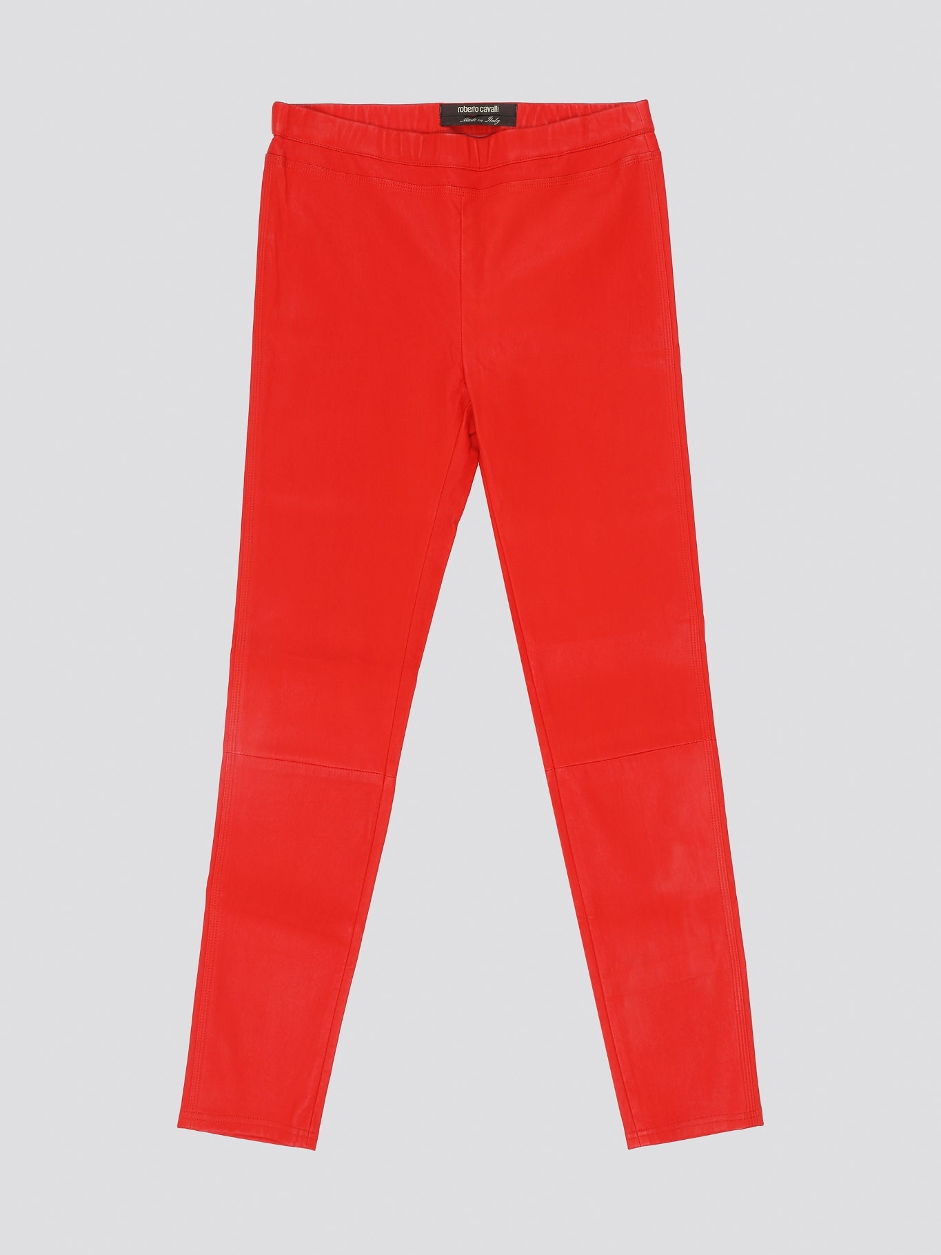 Step out in bold style with these stunning Red Elasticated Waist Trousers from Roberto Cavalli. The vibrant red hue is sure to turn heads, while the elasticated waist ensures a comfortable and flattering fit. Perfect for adding a pop of color to your wardrobe and making a statement wherever you go.