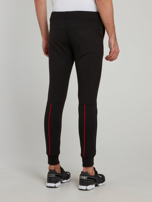 Черные спортивные брюки с красной отделкой