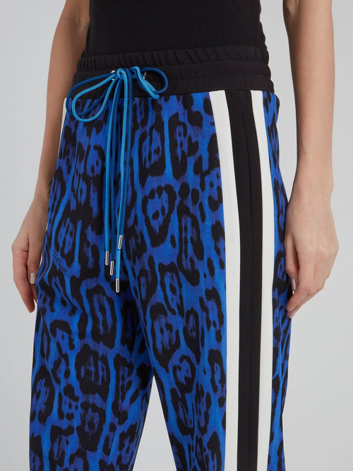 Синие укороченные брюки с леопардовым принтом и лампасами