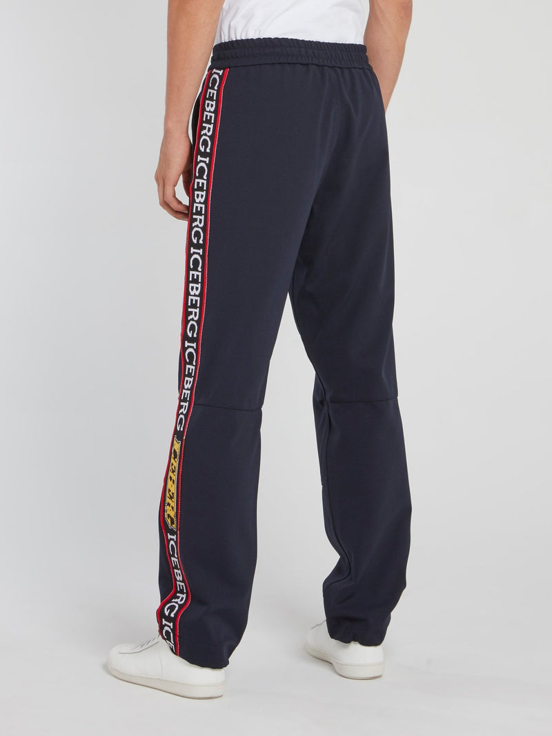 Темно-синие спортивные брюки со шнурком и логотипом на лампасах