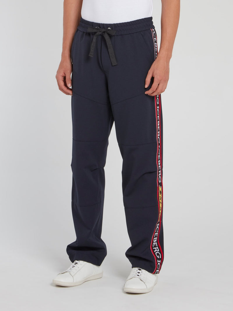 Темно-синие спортивные брюки со шнурком и логотипом на лампасах