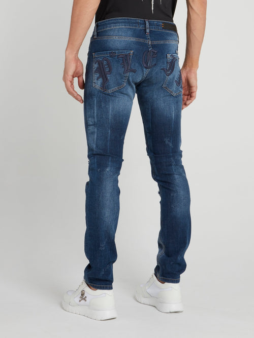Синие джинсы с рваной отделкой Gothic Plein
