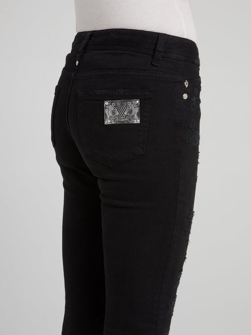 Черные укороченные джинсы с рваной отделкой